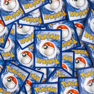 A pile of Pokémon cards, face down
